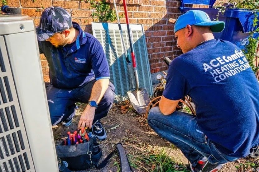 our air conditioning repair contractors repairing an ac unit outside